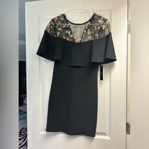 Floral mesh detailing on mini black dress